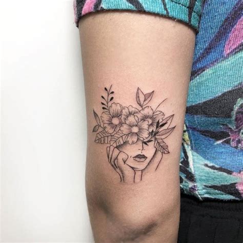 Flower head woman tattoo