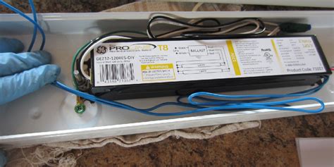 Fluorescent light fixture ballast.  Unplug the fixture or turn off the power ...