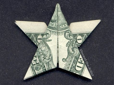 Folding a dollar into a star. 