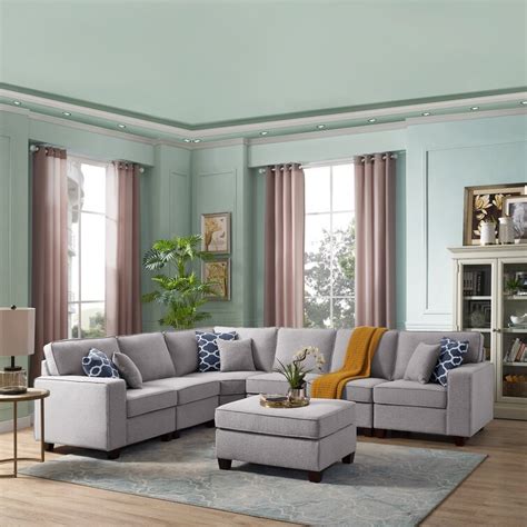 Forbestown 7 - piece upholstered sectional. Armless Chair Dimensions: 25.5" x 33.5" x 35" H (Seat Width 25.5") The dimensions of the blue and white pillow are 14 x 16. The cushions do not come compressed. This sectional can fit a living room wall that is 168 inches long. This product cannot remove a section to set up as a stand-alone chair away from the rest of the sectional. 