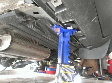 The blue jackstands are secondary locations to act as a backup in case the pinch weld jack stand and front center cross beam jack fails for some reason. You may need to raise car higher to put a 2x4 in between the jack stand and metal frame. Pic 3: Option of jack acting as backup on left pinch weld area, behind jack stand.. 