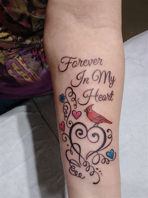 Tattoos can honor the person and help you remember the good times. We have found 43 emotional memorial tattoos that will be a beautiful tribute to any loved one. 1. Memorial Tattoo Idea. Our first tattoo is a beautiful piece that features a bird and a quote. The quote reads “She lived and laughed and loved and left”.. 