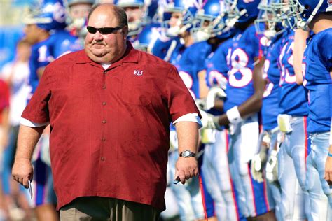 Mark Thomas Mangino (born August 26, 1956) is a former American football coach. He served as the head football coach at the University of Kansas from 2002 to 2009. In 2007, Mangino received several national coach of the year honors after leading the Jayhawks to their only 12-win season in school history and an Orange Bowl victory.. 