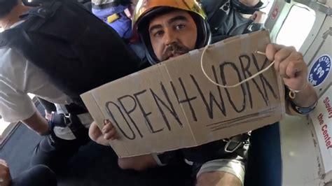 Fort Lauderdale man sky dives with ‘Open 4 work’ sign, lands new job