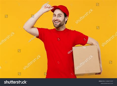 Fotografia do Stock: Professional delivery guy employee man 20s …