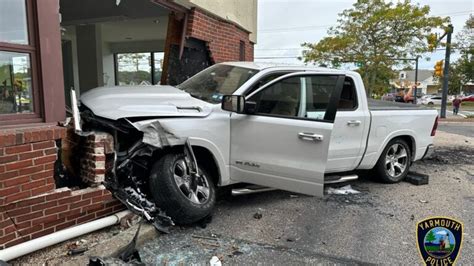 Four people hospitalized after truck driver slams into vehicles, bank in Yarmouth