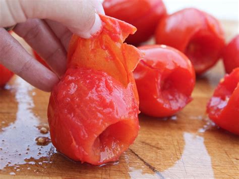 Freezing tomatoes. Place the sheet in the freezer for about 1-3 hours, or until frozen. Take the tomato out and run it under cold water for a few seconds. The skin should just slide right off. Whichever method you use, place the skinned tomatoes in freezer-safe containers, label them, and freeze. 