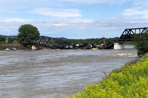 Freight train carrying hot asphalt, molten sulfur plunges into Yellowstone River as bridge fails