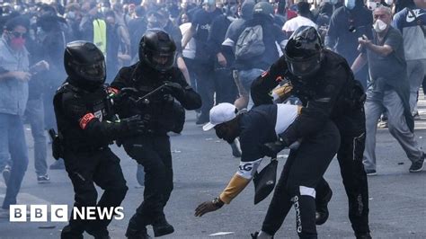 French activists protest racism and police brutality while officers are on guard for key events