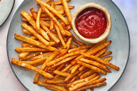 French fries. Drop fries in batches into 375 degree Fahrenheit oil and cook for 1 ½ minutes until dark. Remove from oil and dress with salt. 
