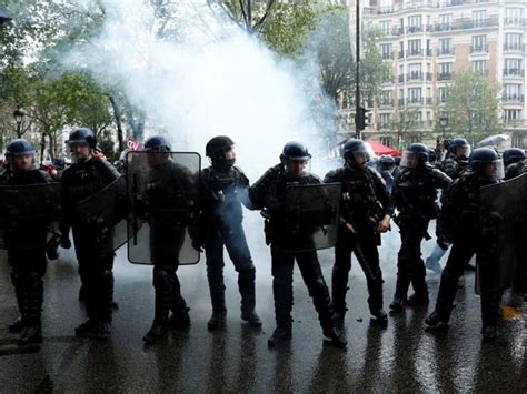 French police clash with black-clad anarchists during May Day rallies