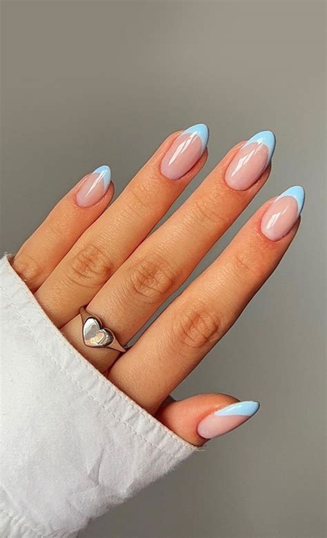 This light blue square nails with French tips is a very classic and timeless design. I love how the designer used a light blue nail polish to create a soft and delicate look. The French tips are a nice touch and really add an extra level of sophistication. This mani would be perfect for any occasion, from a formal event to a day out with the girls.. 