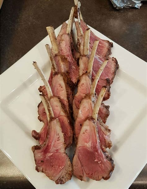 Frenched lamb rack. Preheat oven to 450F. Be sure your oven has reached the full 450F before adding the meat. Preheat skillet on stovetop over medium-high heat. Add 1 T olive oil and heat until it is shimmering. Add racks, fat side down and sear for 2-3 minutes. Turn over and sear the non-fat side for 1 minute. 
