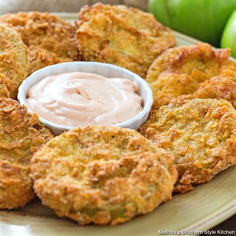 Fried green tomatoes. In a deep-fryer, preheat oil to 350 degrees F. Season tomatoes, on both sides, with salt and pepper. Place flour and garlic powder in a shallow dish. 