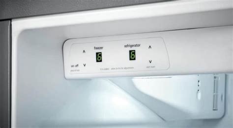 The reset button on a Frigidaire freezer is typically located