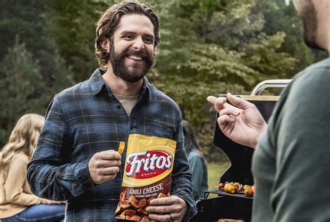 Fritos commercial rapper. It seems like the perfect line to go with Frito-Lay's Super Bowl campaign, which the brand hopes will motivate you to "unleash your Flamin' Hot" wherever you are — be it in the comfort of your living room or the middle of the forest. Flamin' Hot's 2022 Super Bowl commercial is backed by a very familiar beat. Here's what song it's from. 