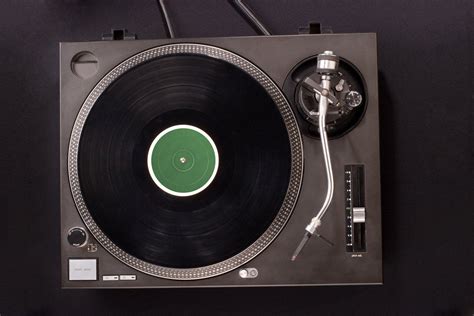 Frog on top of record player with background music