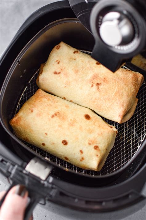 Frozen burritos in air fryer. Here is how you can reheat your chipotle burrito in an air fryer: Preheat the air fryer to 325 degrees Fahrenheit. Meanwhile, brush some cooking oil or olive oil evenly on all sides of the chipotle burrito. You do not need to wrap your burritos in an air fryer. Then, layer the burritos in the air fryer basket. 