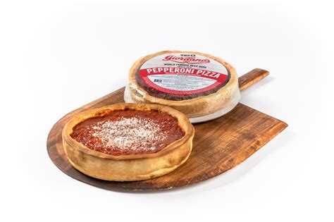 Frozen chicago pizza. Preheat oven to 425°F. Microwave frozen deep dish, on plate, for 6 minutes on high. Take out plate (careful, plate may be hot), and then let pizza rest for one minute. Position pizza on center rack in oven and bake for 15-18 minutes, or until internal temperature reaches 165°F. Take pizza out of oven and let sit for 5-10 minutes before ... 