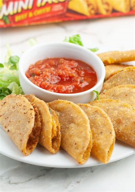 Frozen mini tacos. How to air fry frozen mini tacos. Open up your bag of frozen mini tacos. Place in your air fryer basket in a single layer. Air fry at 370 degrees F for 7-8 minutes, no flipping required! Serve as desired. 