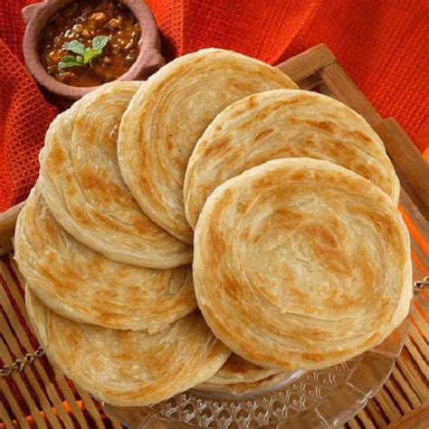 Frozen paratha. Paratha Paratha Dough: -In a bowl,add clarified butter & whisk well until it changes its color (2-3 minutes). -Add all-purpose flour,wheat flour,sugar,baking soda,pink salt & mix well until it crumbles. -Gradually add milk,mix well & knead until dough is formed. -Grease dough with cooking oil,cover & let it rest for 1 hour. 
