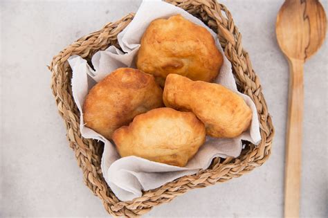 Fry bread recipe. How to Make Fried Bread: Step 1 – First, you need a large bowl. Add the flour baking powder and salt to the bowl and combine together. We recommend mixing with a wooden spoon. Step 2 – Then slowly stir in the warm water until the dough starts to form. 