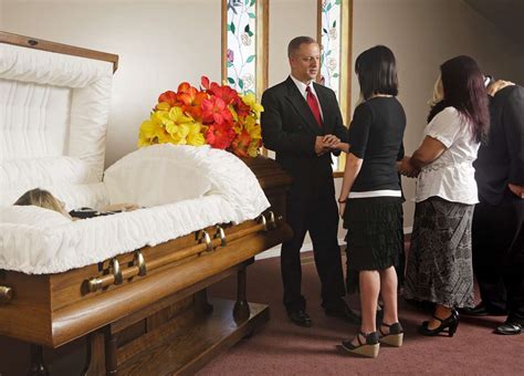 Funeral wake vs visitation.  During times Religious funerals often include pra...