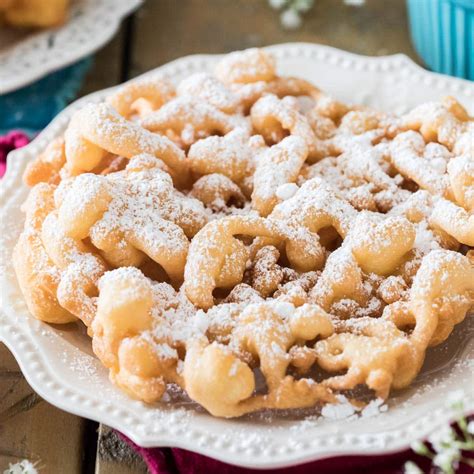 Funnel cake recpie. Covering spout with finger, pour 1/4 cup batter into funnel. Remove finger and release batter into oil in a spiral, starting in center and winding out. Fry until golden about 3 minutes. 