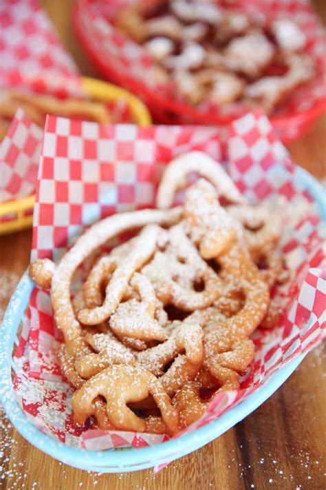 Funnle cake. funnel cake: [noun] a small spiral-shaped cake fried in a skillet. 