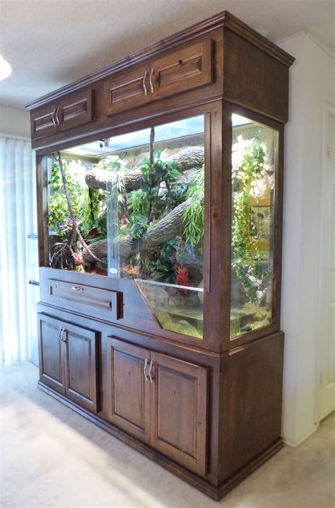 Furniture reptile enclosure. To convert furniture into reptile enclosures, start by measuring the space you have available and selecting a piece of furniture that is suitable for the size of your enclosure. Make sure to choose one made from non-toxic materials such as plastic or glass. Next, remove any shelves or drawers inside the furniture and seal off any holes in … 