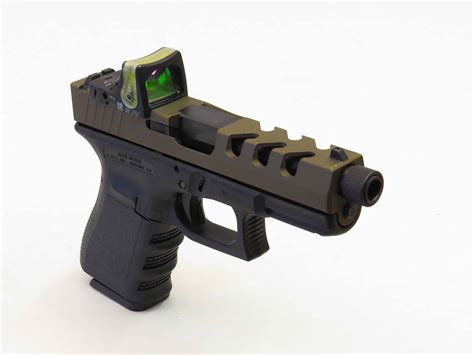 NEW! Super deep front and rear serrations + Open ports. From $398.00 | Available for: Glock 19, Glock 23, Glock 17, Glock 22 frames. Raptor One Slide BEST SELLER! Aggressive serrations front and back with 2nd stage ventilation serrations up front. Slides available for: Glock 19, Glock 23, Glock 17, Glock 22, G34 Competition frames. The Portal Slide. 