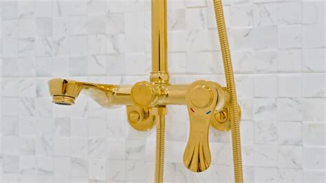 Gold shower head for luxurious bathroom updates - balustradellc