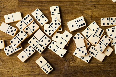 Game of dominoes. To play dominoes, first shuffle the tiles. Then, the first player plays a domino based on agreed upon criteria, and the next player connects one end of a domino on the field to the... 