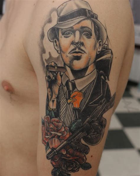 Gangster tattoos for guys. Another important feature of gangster tattoos is the smile. You should show a grinning gangster in your tattoo design. 18. Instead of going for gangsta tattoos you can pick up your favorite rapper and have his portrait as your tattoo design. 19. Al Capone is cited as the most infamous gangster of all time. 