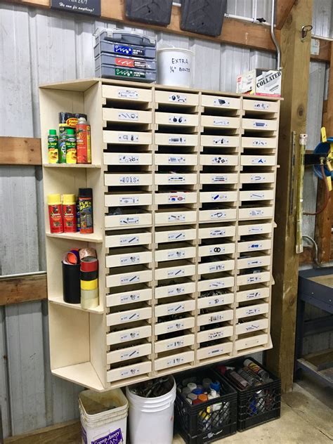 Garage bin storage. Ideal for small space organizing. Anti-slide lock keeps stacked bins steady. Heavy duty plastic construction. Will not rust or corrode. Label slot for easy marking. Available in a smaller 11 in. x 5 in. size. 5 in. H x 11 in. W x 23 in. D. Compatible with Husky garage steel cabinets. Modular stacking ability with standard smaller 11 in. x 5 in ... 