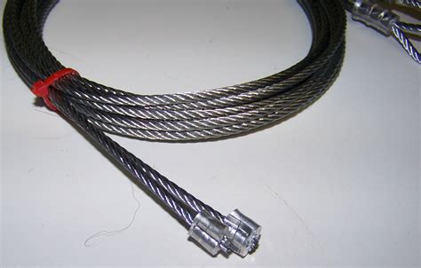 Garage door cable. How to determine cable length for garage door cable repair On a standard 4” drum on a standard residential installation, the cable is 18” longer than the height of the door. Specialty drums and hi-lift or vertical lift setups require a specific cable length depending on the drum, lift height, and door weight. 