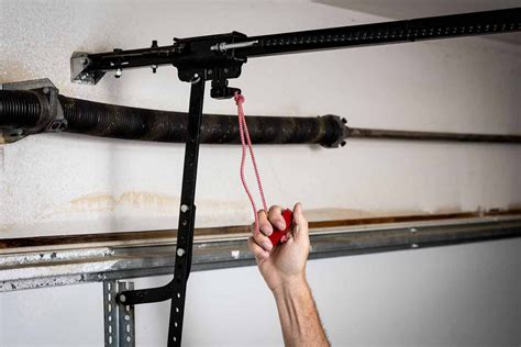 Garage door emergency release. If your garage door has a garage door emergency release kit, it usually comes with a lock and a cord. This cord is what you need to pull down. Fortunately, it’s easy to reach it if you’re tall. Otherwise, you would need … 
