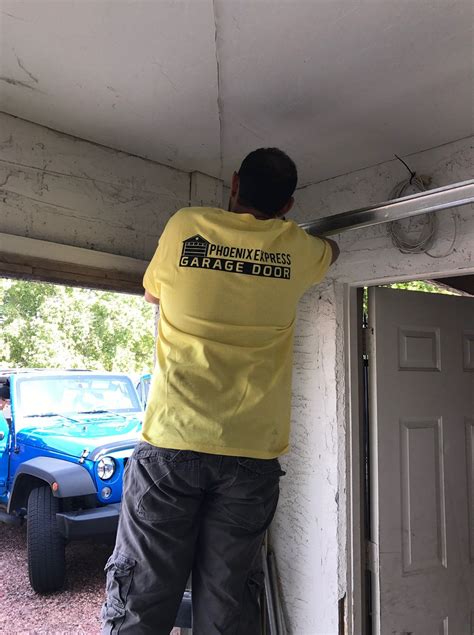 Garage door repair in phoenix. We provide garage door repairs, new garage door replacement, new tracks and rollers, garage door openers, spring and cable repairs for all of Phoenix. 