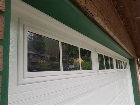 Garage door window insert. First Steph removed the plastic inserts covering the garage windows. These had become faded and brittle. She thought the inserts gave the garage door a ... 