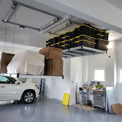 Garage storage lift. A: A DIY garage ceiling storage lift is a system used to raise and lower items such as bikes, kayaks, storage boxes, and other bulky items for overhead garage storage. It typically involves using a pulley and hoist system to … 