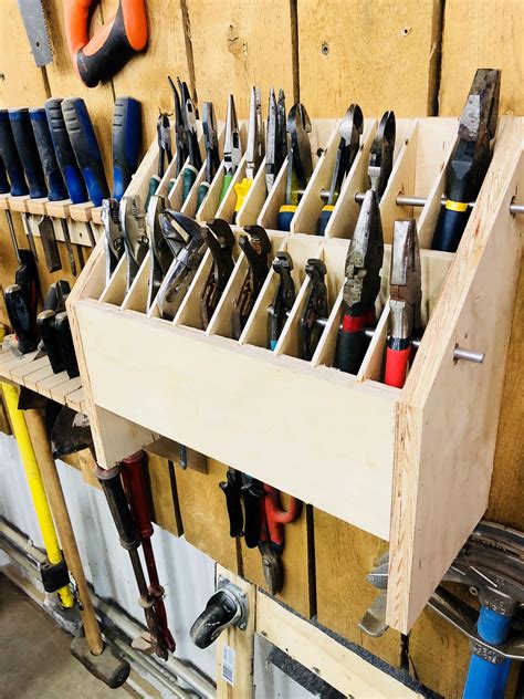 Garage tool organization. Here's how: Cut and screw together the sides and ends with the ends protruding 1 in. beyond the sides. Drill holes in the top of the ends for a 3/4-in. dowel handle and tap it in the holes before assembling the ends and sides. Drill the 3/8-in. storage holes in the top edges of the sides before assembly. 
