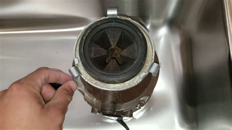 Garbage disposal humming but not working. Whenever a garbage disposal is humming but not working it typically indicates that the motor is receiving power but is unable to rotate the internal blades. This is usually a sign that the disposal is jammed or stuck. The humming noise comes from the motor trying to spin but can't because of something in the way. 