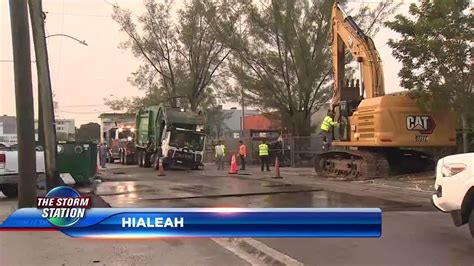 Garbage truck hits hole in road causing damage, traffic delays in Hialeah