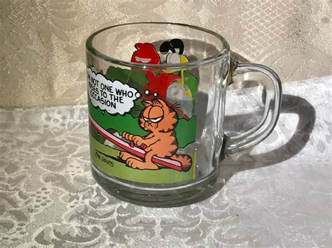 Vintage Garfield Mugs Coffee Cups Jim Davis Set Of 2 1980 McDonalds Clear Glass . Opens in a new window or tab. Pre-Owned. $0.99. smilingsam-tumblers_and_collectables (7) 100%. 1 bid · Time left 4d left (Tue, 06:37 PM) +$17.05 shipping. 