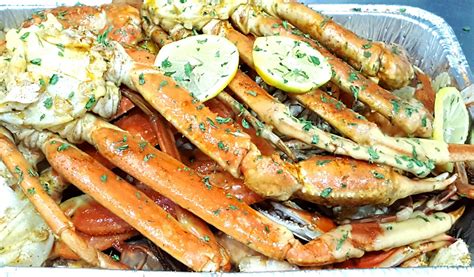 Garlic crab trays near me. 1. A sides tray consisting of two half-ears of corn, a whole large russet potato, three hard-boiled eggs, and a smoked sausage. 2. Garlic Blue Crabs 3. Steamed peel-and-eat shrimp 4. Two large snow crab claw clusters We also got two pints of seasoned butter on the side. No one "needs" two pints of butter, but I'm never going to say "no" to it ... 