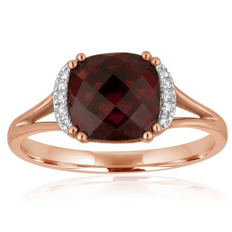 Garnet and diamond ring. Setting made entirely with genuine solid 14 karat gold. Main stone size: 6x4 mm. All gemstones are genuine. 30 Day Satisfaction Guarantee. Photos may have been enlarged to show detail. Please see specifications below for product measurements. See product specifications. To buy, select Ring Size. Add to Cart. 