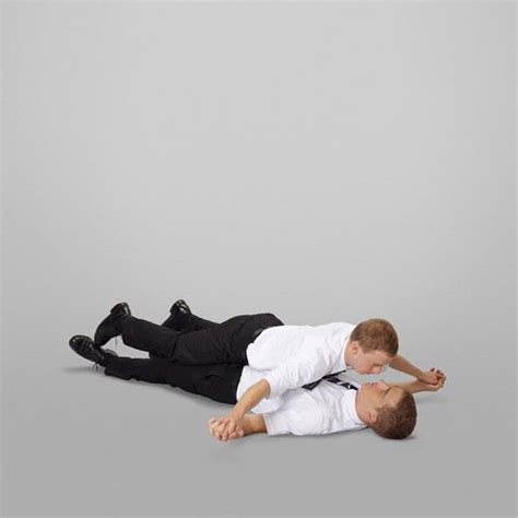 Rotate the arms outward so the palms face forward toward your partner. On an exhale, begin to fold forward. Once you are at a 90-degree angle, where your torso is parallel to the ground, place your hands on your partner’s back, face down. Your head is in line with your spine, eyes gazing at the ground.