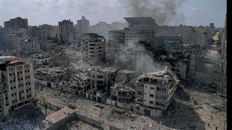 Gazans scramble for safety as Israeli airstrikes pound sealed-off territory to punish Hamas