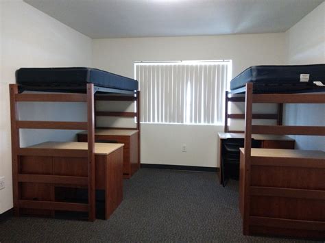Smoking is prohibited in all University Housing. Residential facilities vary by size, room type, and ratio of first-year to upper-class students. Standard furniture measurements: Twin XL Bed: 36"x 80" with adjustable height to 30" clearance under bed. Dresser: 32"x24"x30" (fits under the bed) - 3 drawers. Desk: 48"x24"x31 .... 