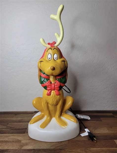 Here’s your chance to get Max the dog from The Grinch Who Stole Christmas. He is a must have for any blow mold collector. He is approximately 2ft tall. Please look at the photos. It has some normal paint issues. (Scratches , overspray or Chips) It also has two small dents on the bottom of the base. Thank you and stay safe.. 